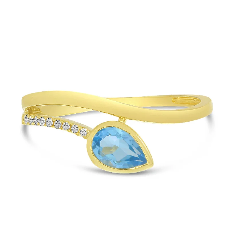 Trending Jewelry Now Available At Exclusive Prices 14K Yellow Gold 0.48ct. Pear Blue Topaz & 0.04ct. Diamond Wave Bypass Fashion Ring Trending Jewelry Now Available At Exclusive Prices 14K Yellow Gold 0.48ct. Pear Blue Topaz & 0.04ct. Diamond Wave Bypass Fashion Ring