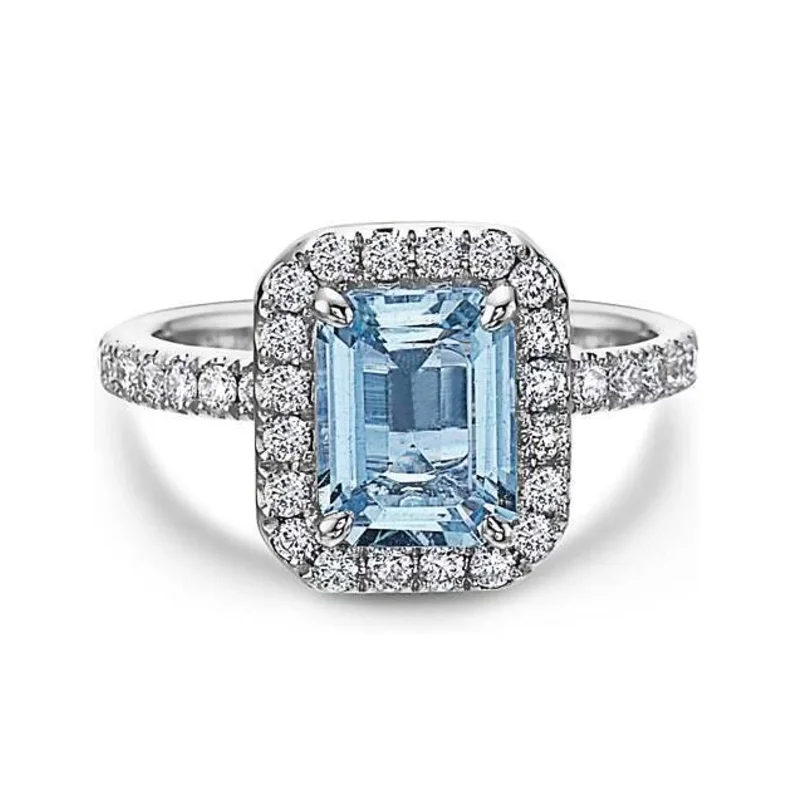 Elevate Your Outfit With Discounted Statement Jewelry Aquamarine & Diamond Halo Ring Elevate Your Outfit With Discounted Statement Jewelry Aquamarine & Diamond Halo Ring