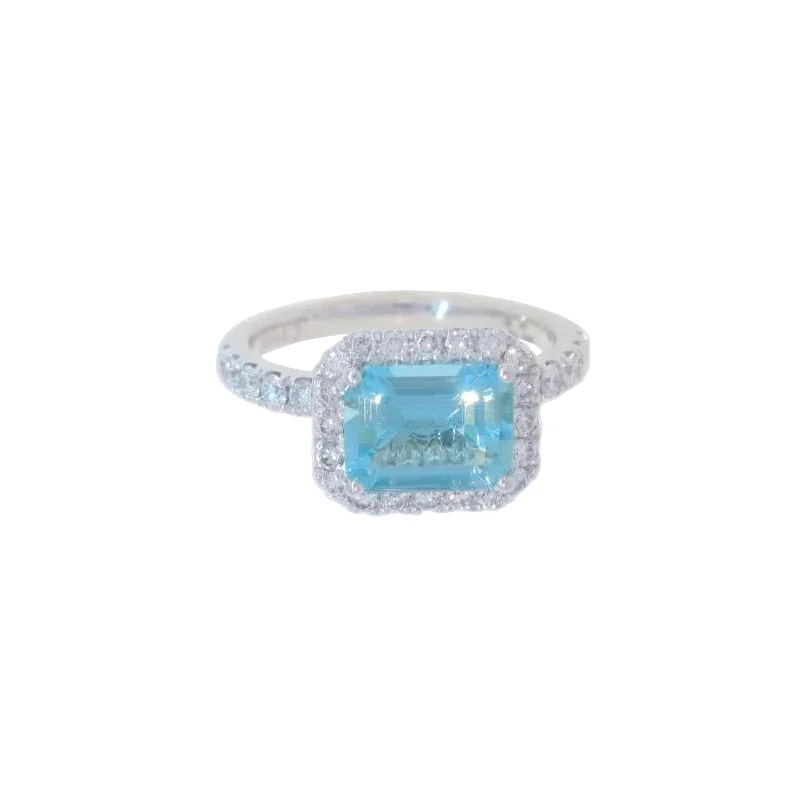 Luxury Jewelry Without The Luxury Price Tag East-West Aquamarine and Diamond Halo Ring Luxury Jewelry Without The Luxury Price Tag East-West Aquamarine and Diamond Halo Ring